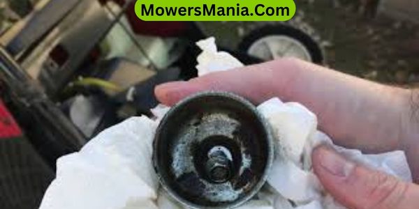 Can you clean a lawn mower carburetor without removing it