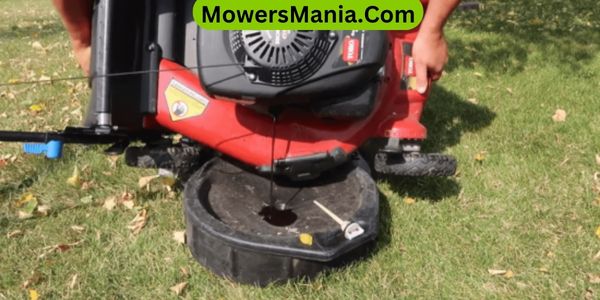 How do I know if my lawnmower is low on oil