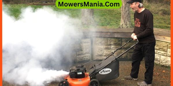 Why is my mower smoking after adding oil
