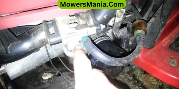 How do you remove the gasoline from your lawn mower